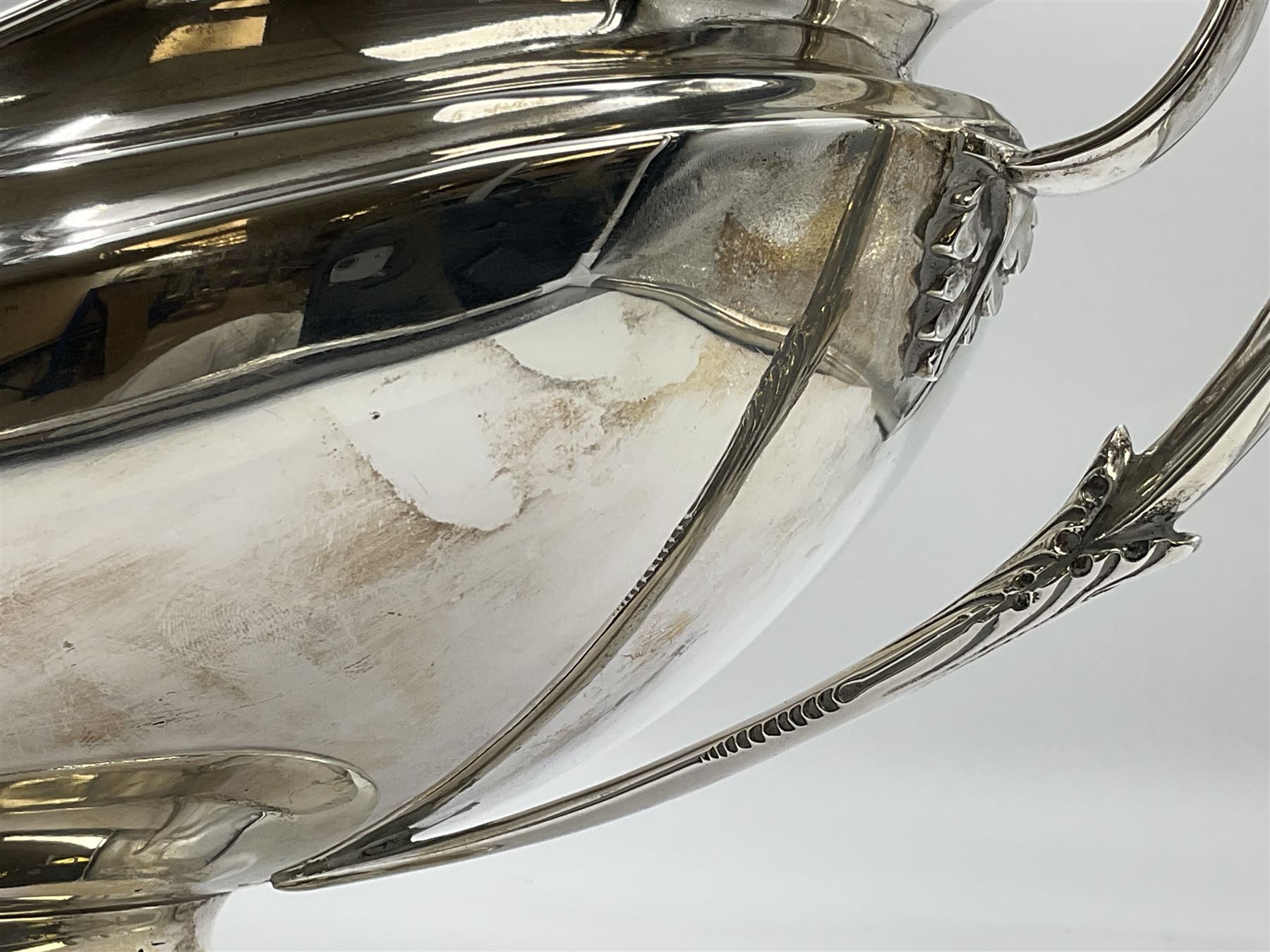 1920s silver twin-handled pedestal bowl, of navette form with twin bifurcated acanthus capped scroll handles, engraved with initial R to body and upon spreading oval foot, hallmarked Hawksworth, Eyre & Co Ltd, Sheffield 1925, including handles H21.8cm