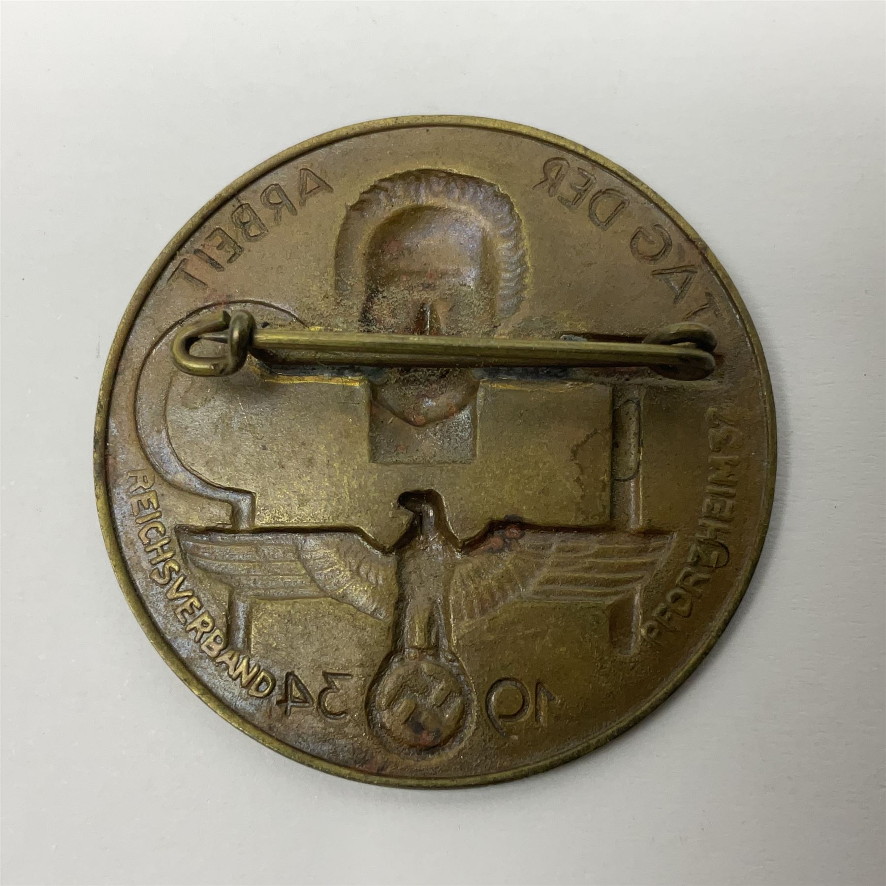 WWII German Iron Cross 2nd Class with ribbon; WWI German Wuerttemberg Medal with ribbon; and Day Badge for 1934 marked Reichsverband Pforzheim32 (3)