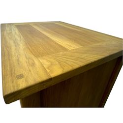 Laura Ashley - contemporary Milton oak display cabinet, featuring single door with two glass panels and pewter effect handle, enclosing one fixed oak shelf and two adjustable glass shelves, access hole at the bottom shelf, over single drawer with matching handle, on square legs