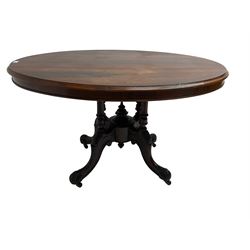 Victorian rosewood breakfast table, oval moulded tilt-top on quadruple turned pillar base, central turned finial, on four acanthus and scroll carved supports