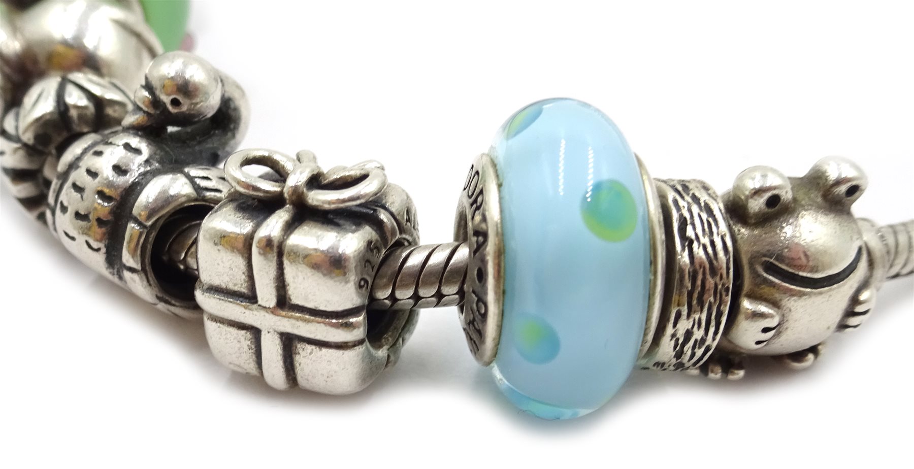 Two silver Pandora charm bracelets, each with eight Pandora charms, all