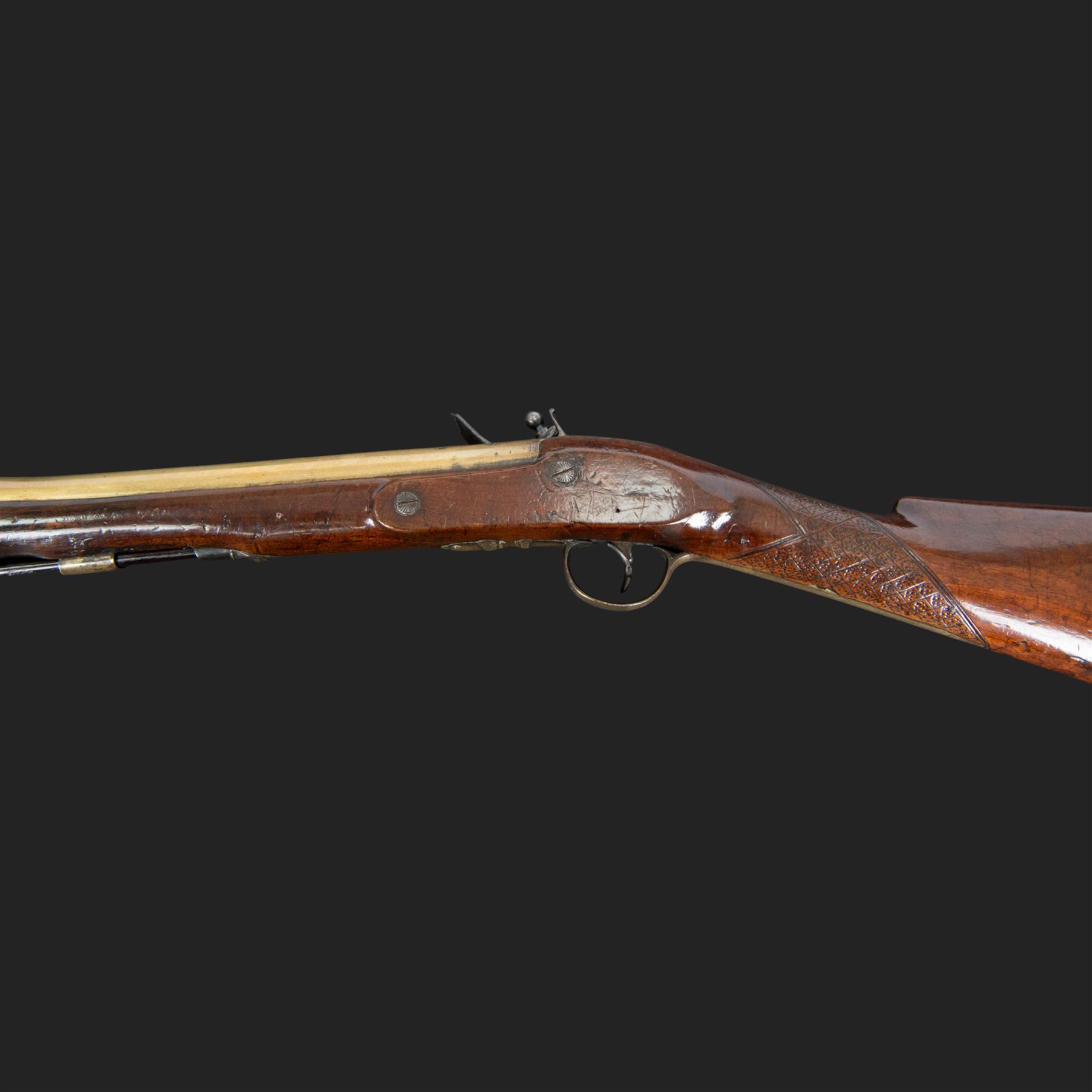 English flintlock blunderbuss, circa 1780 by R. Sutherland of London, the 32cm brass barrel with proof marks and London to the top, with original ramrod with brass tip below, the lock engraved Sutherland, walnut stock with brass butt plate, steel trigger guard with acorn finial, overall L70cm  