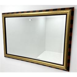 Gilt framed rectangular bevel edge wall mirror with stripped border
