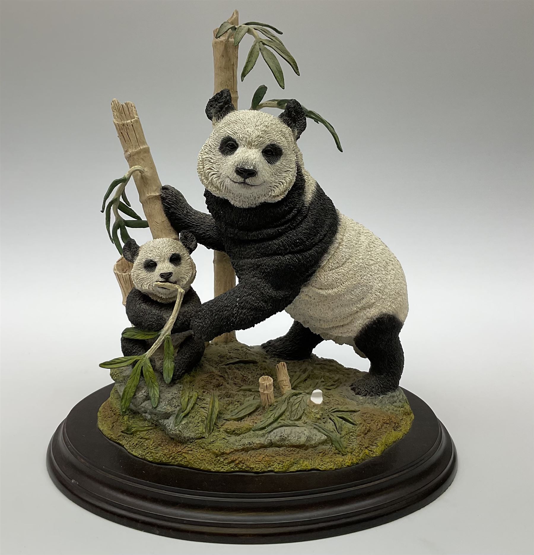 Three Franklin Mint figures, first example On The Prowl, on wooden stand H32cm, L63.5cm, Grizzly, H23cm and American Majesty by Ronald Van Ruyckevelt H37cm, together with five other figures.  
