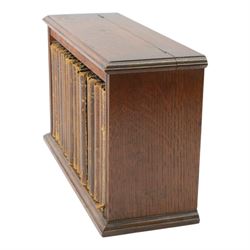 Dickens Charles, The Complete Works of Charles Dickens, 17 Vols, illustrations by 'Phiz', London, Chapman & Hall, Limited; and Henry Frowde, New York; Oxford University Press American Branch, later replaced boards, housed within an oak table top bookcase, with hinged lid, titled 'The Complete Work of Charles Dickens', together with a number of other books

