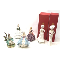 A group of figurines, comprising two box