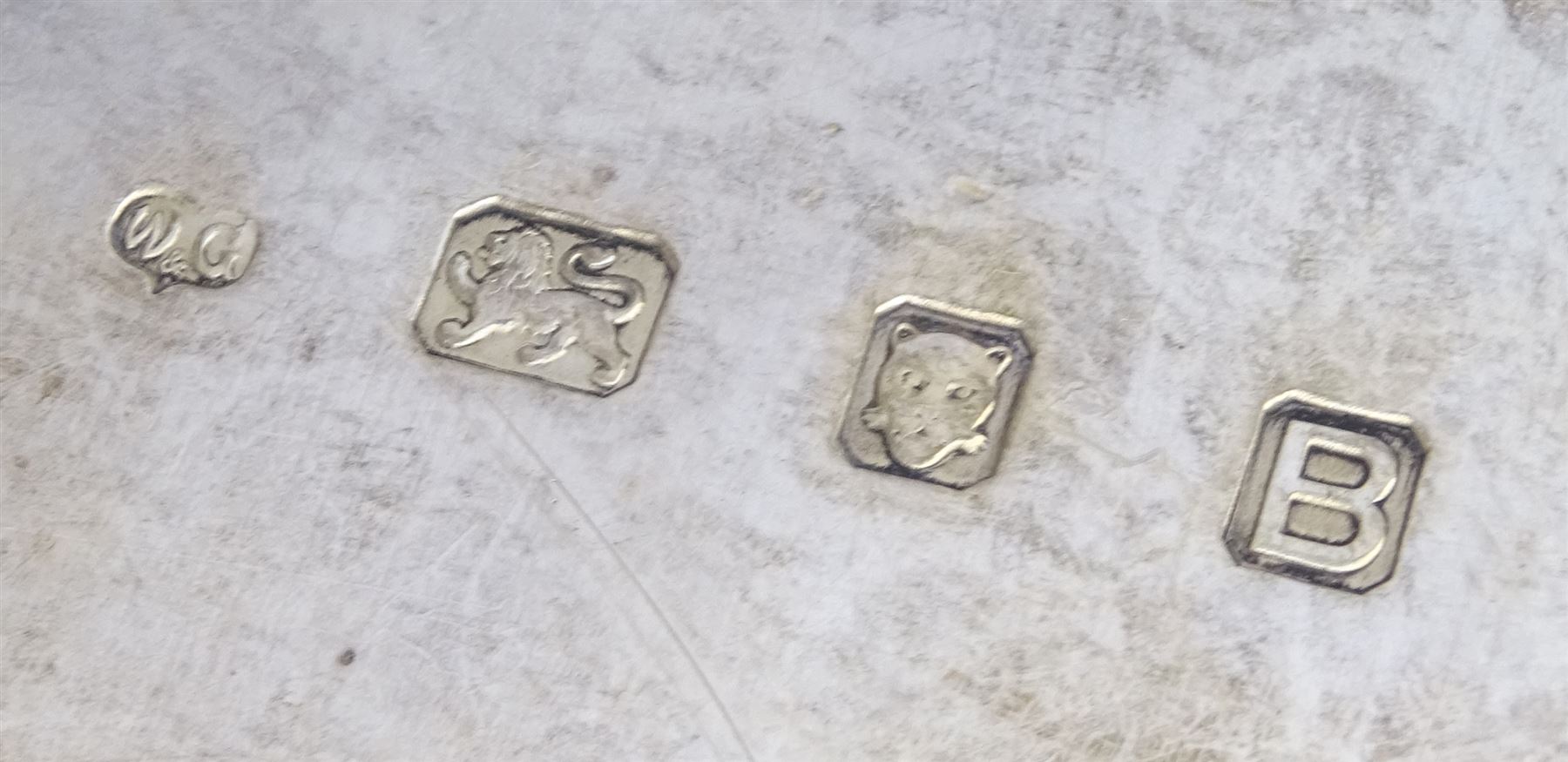 Raich Carter - presentation hallmarked silver two-handled tray of rounded oblong form with gadrooned rim by Wilson & Gill, 139 Regent Street, London, inscribed to the centre 'Presented to Mr. & Mrs. Raich Carter by the Lord Mayor of the City and County of Kingston-upon-Hull Alderman R.E. Smith J.P. on May 30th 1952on behalf of the many Admirers who subscribed to The Lord Mayor's Testimonial Fund in recognition of Raich Carter's genius as a footballer and his services to the City', London 1937 82oz L61cm; together with a hallmarked silver four-piece tea and coffee set by Cooper Bros. & Sons Ltd, the teapot of London shape with ebonised handle and knop, each piece engraved with an initial 'C', Sheffield 1920  60.5oz, teapot L29.5cm