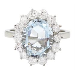  18ct white gold oval cut aquamarine and round brilliant cut diamond cluster ring, hallmarked, aquamarine approx 2.50 carat, total diamond weight approx 0.90 carat