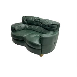 Two seat serpentine sofa, upholstered in green buttoned leather