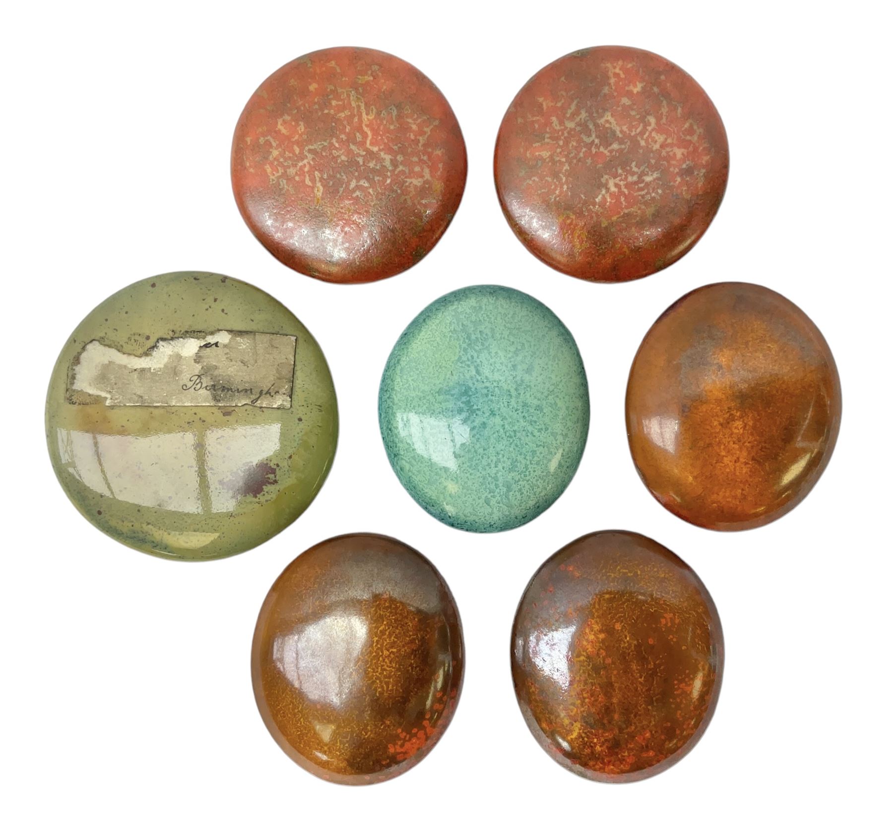 Henry George Murphy (1884-1939), collection of seven Arts & Crafts glazed ceramic roundels, of circular and oval form, five in tones of red and brown and two in tones of blue, turquoise and green in soufflé and high fired finishes, largest example D6.5cm