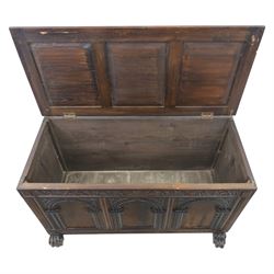 17th century design panelled oak blanket chest, hinged top above carved triple arch frieze, raised on individual carved claw feet