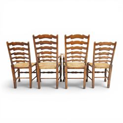 Set of eight country ladderback chairs (6+2), shaped ladderback over a rush seat, raised on turned supports, united by stretchers
