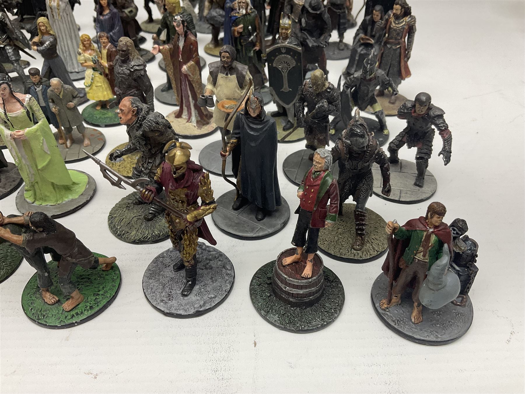 Approximately 80 NLP Lord of the Rings heavy metal painted figurines to include Fell Beast, boxed, and The Watcher, The Dark Lord Sauron, Treebeard etc, and unassociated Dracula themed composite figures marked HHFT50 