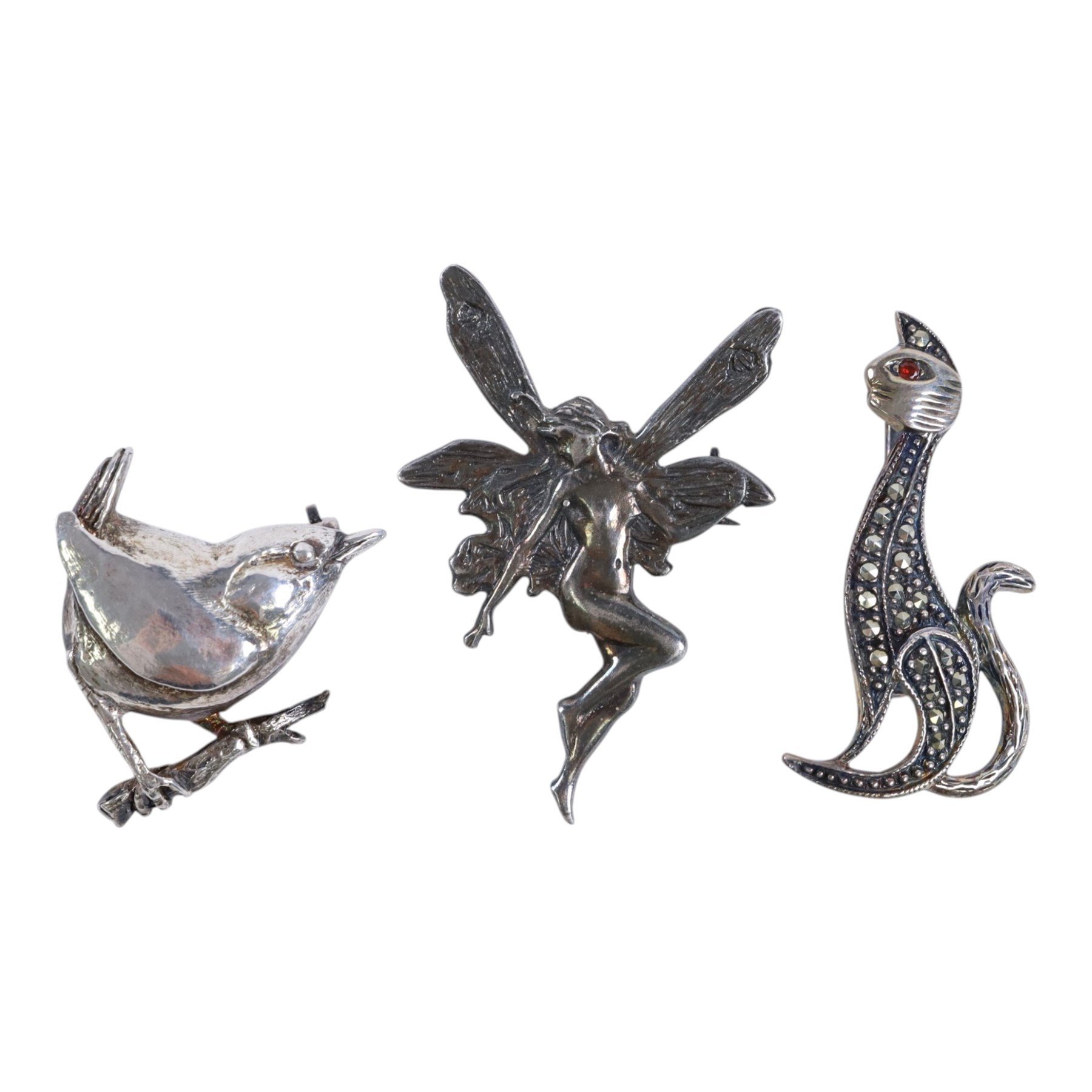 Collection of silver, including Kangaroo book mark, six silver brooches, comprising silver-gilt scottie dog, fairy, marcasite cat, Celtic stag, Essex regiment and wren, vesta case and bible locket