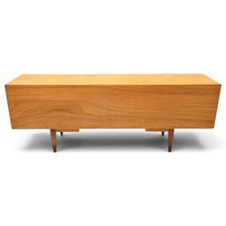 G-Plan - 'Fresco Long John' teak mid 20th century sideboard, a central bank of four drawers, flanked by twin cupboard doors, with recessed handles, on a tapering supports 