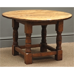  Circular country oak occasional table on joint base, turned supports connected by stretchers, D68cm, H43cm  