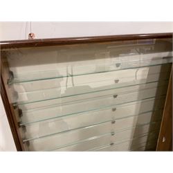 Four die-cast model wall mounting display cases by Picture Pride Displays Sandwell; each with mahogany stained frames and glazed fronts; three 83 x 75.5cm with eleven plate glass shelves and one 57 x 106cm with five plate glass shelves (4)