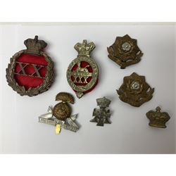 Over thirty regimental cap badges for fusiliers, Yorkshire interest, Light Infantry etc including Royal Scots and Welsh fusiliers, Durham L.I., KO Yorkshire L.I., Oxford & Bucks L.I., Green Howards, East Yorkshire, West Riding, York North Riding etc 