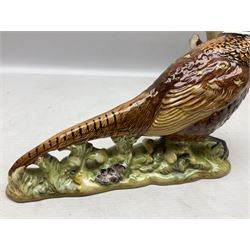 Three Beswick figures of birds, comprising pheasant no 1225, magpie no 2305 and woodpecker 1218, all with impressed marks beneath, tallest H22cm