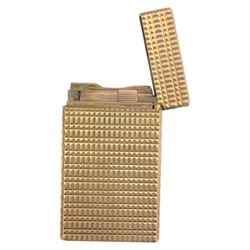 Two S.T. Dupont lighters, comprising red laque-de-chine example, boxed and a gold-plated textured example