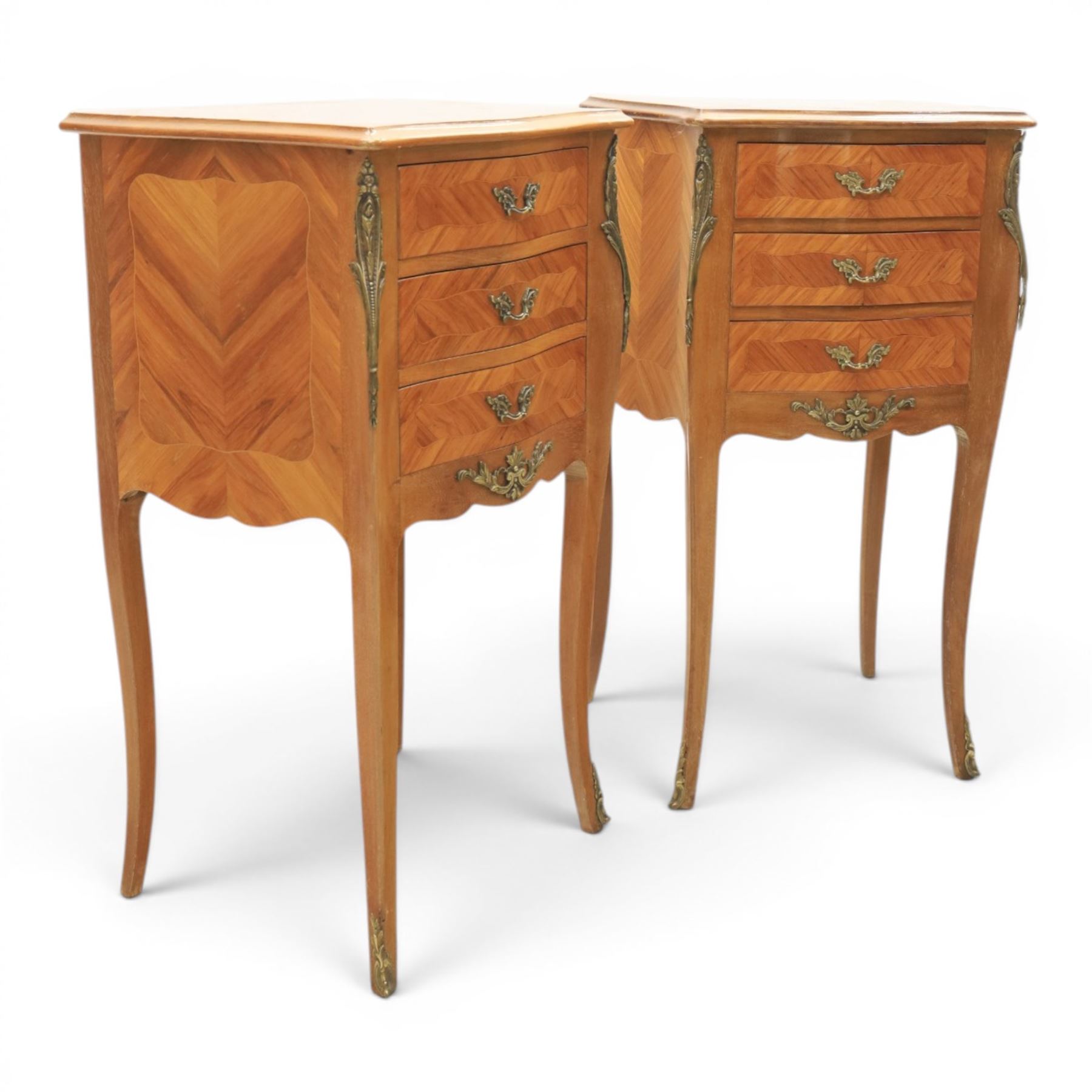 Louis XV style pair of kingwood bedside chests, each of serpentine outline with three parquetry drawers, gilt metal mounts and handles, raised on slender cabriole legs