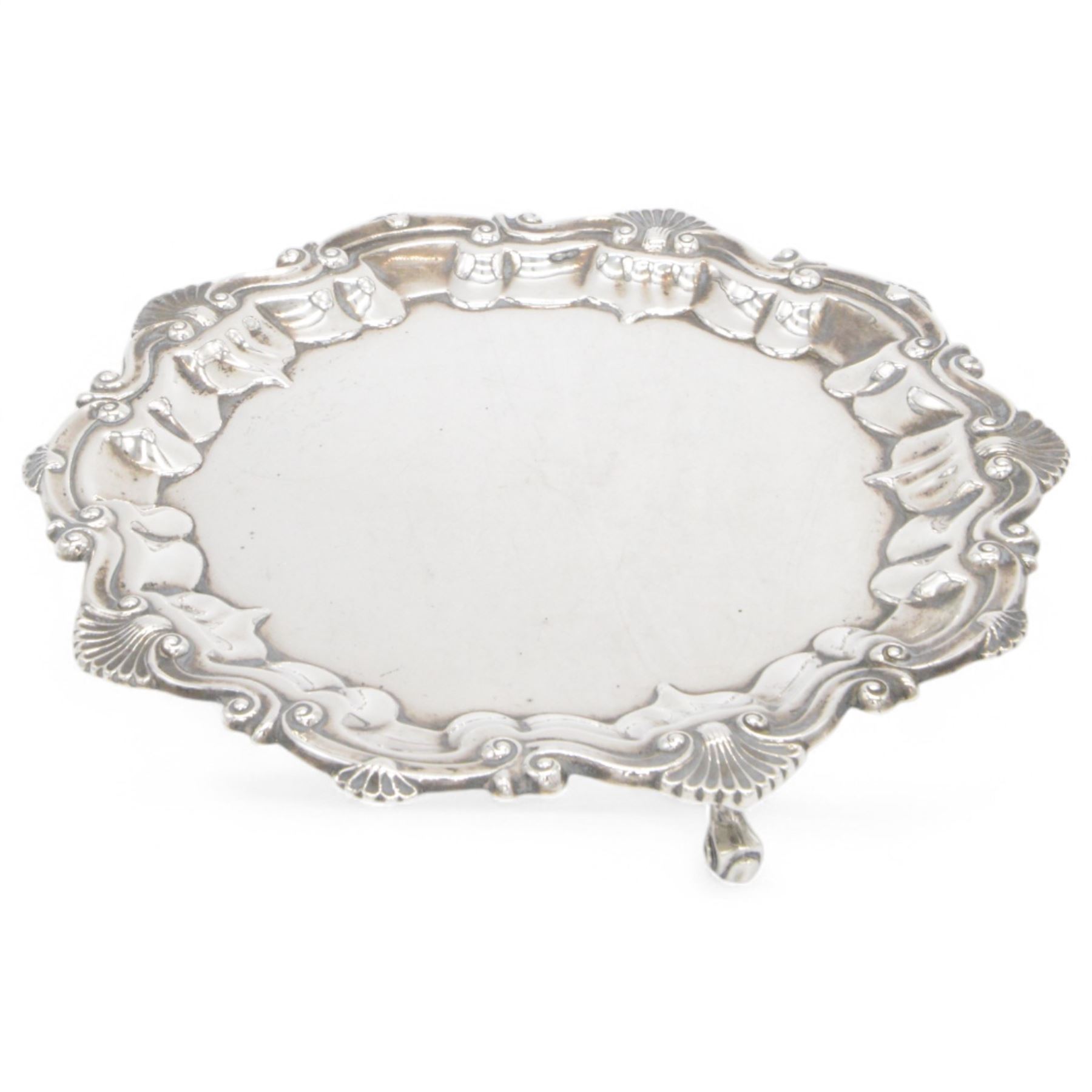 Edwardian silver waiter, of typical form with palmette and C scroll rim, upon three scroll feet, hallmarked Chester 1909, maker's mark MEB over FEB, W23cm