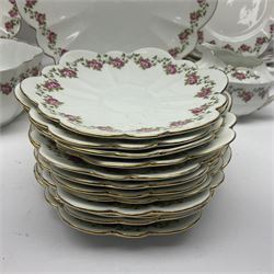 Shelley Late Foley part tea service, pattern number 10137, decorated with roses, comprising eleven teacups and twelve saucers, milk jug, sugar bowl, twelve side plates and two sandwich plates (39)