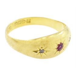 Early 20th century 18ct gold ruby and diamond gypsy ring, single round cut ruby with a rose cut diamond set either side, Chester 1919