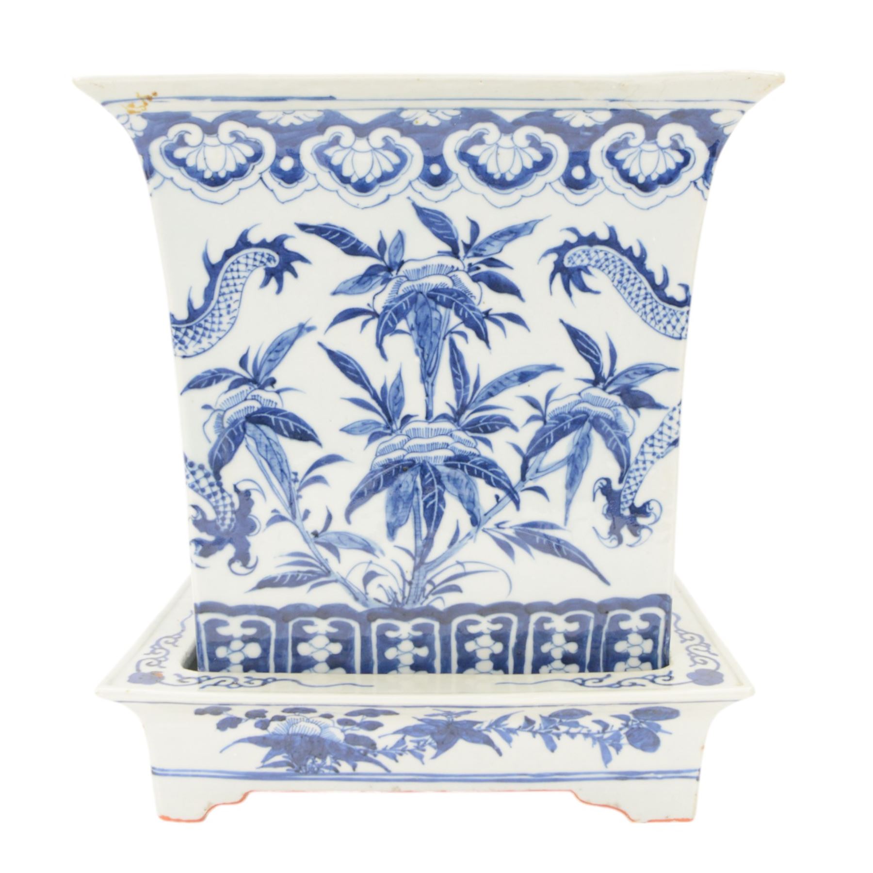 Chinese blue and white planter and stand, each of square slightly tapering and flared form, the planter decorated with two dragons and blossoming peonies, between stylised borders, the stand decorated with flower heads and vines, planter H30cm W29cm, stand H7cm D28.5cm