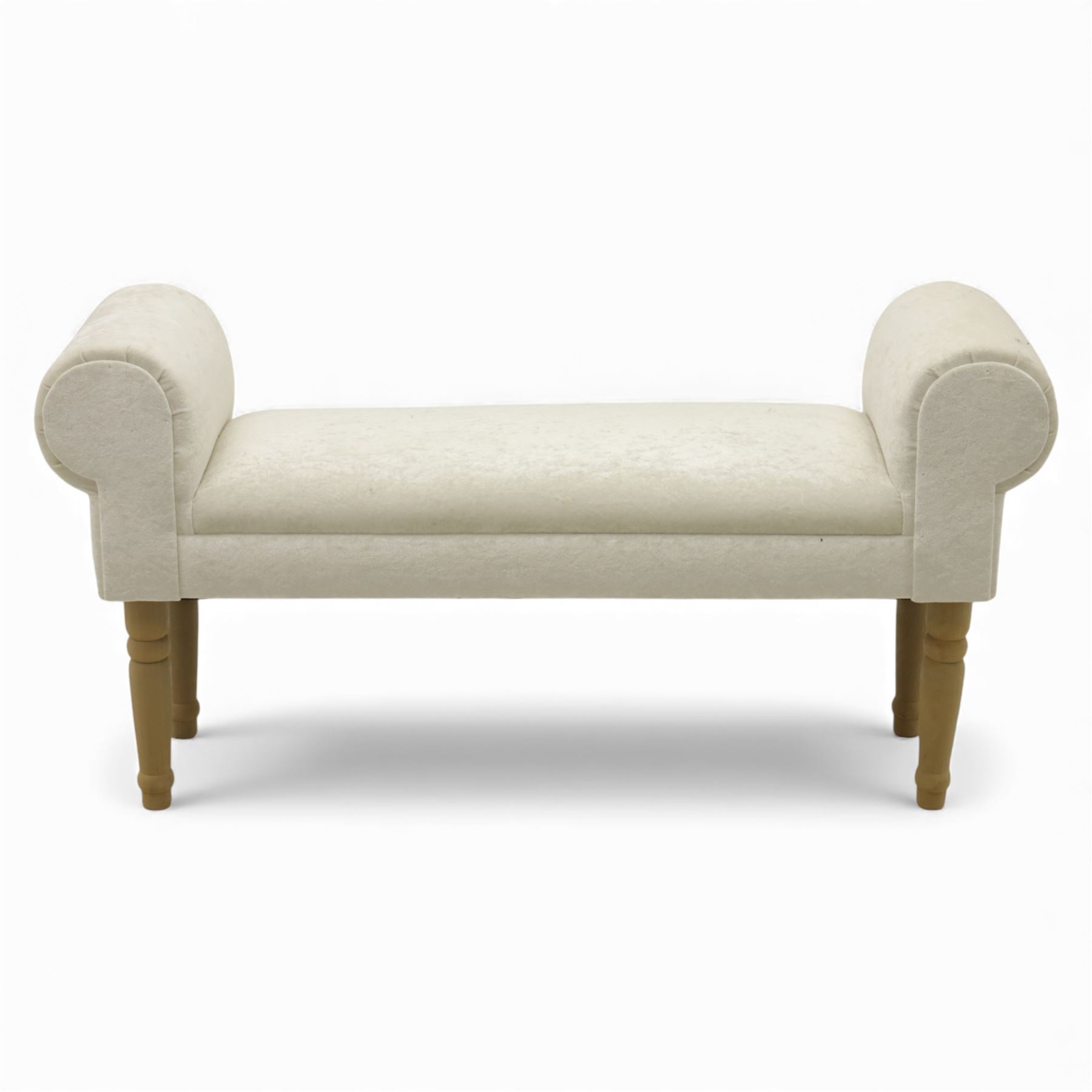 Contemporary upholstered window seat, rectangular padded seat with shallow scroll ends, upholstered in light cream fabric, raised on four turned wooden supports
