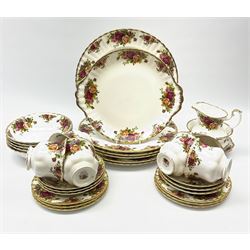 Royal Albert Old Country Roses pattern tea and dinner wares, comprising six dinner plates, five bowls, six side plates, cake plate, butter dish, six teacups and six saucers, open sucrier, and milk jug.