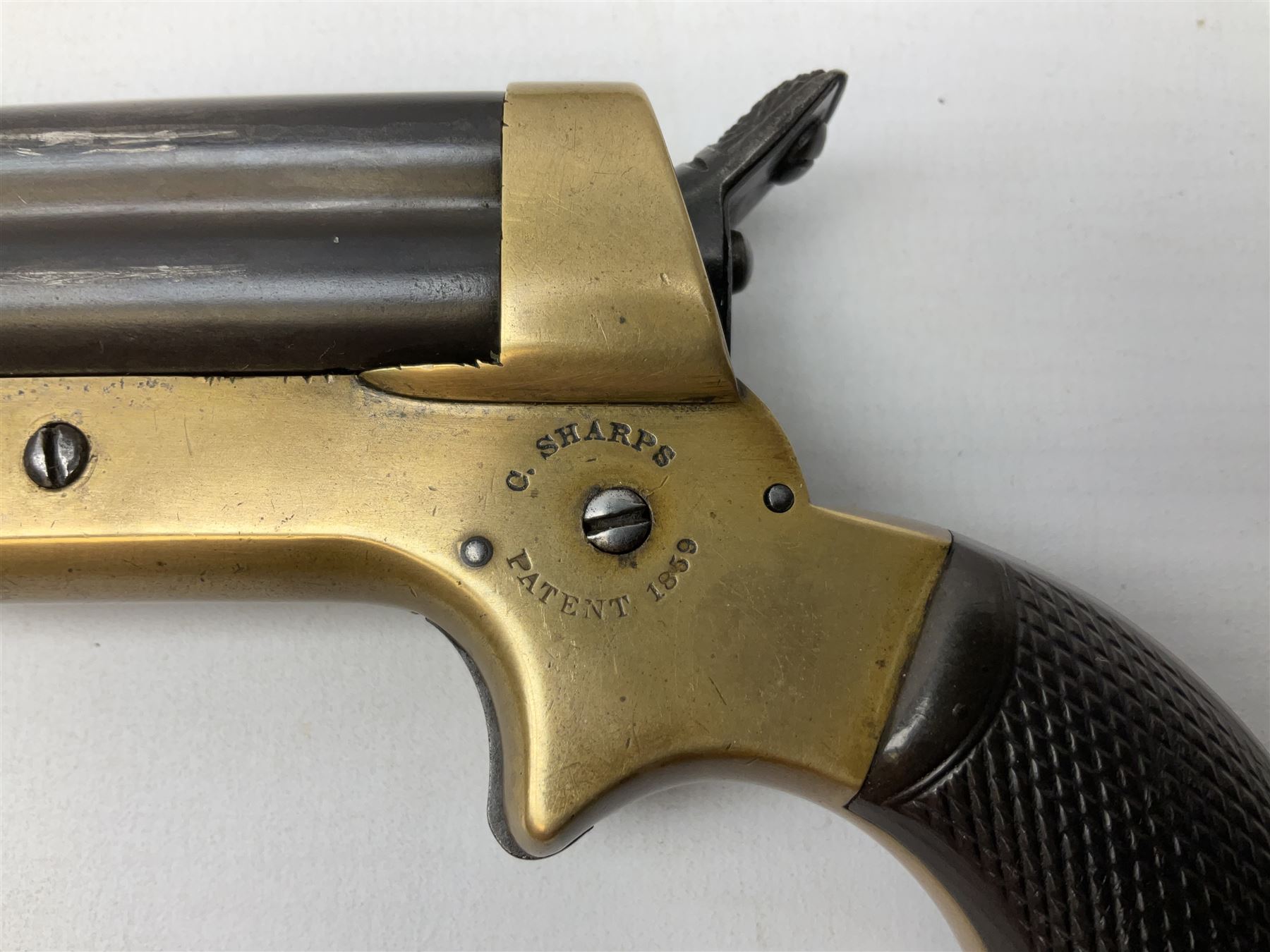 Mid-19th century Sharps' Patent Repeater four-barrelled Deringer pistol, dated 1859, approximately .30 calibre rim fire, brass bodied with rotating firing pin, serial no.8767, L16cm; in fitted rosewood box with label under lid, rack of ten deactivated cartridges, oil bottle and screwdriver and owner's name in brass cartouche to lid.