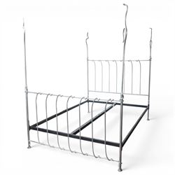 And So To Bed - 'Squigalina' silvered metal framed 5ft king size four poster bed, the tubular chrome posters in scrolling foliate form, over a shaped and scroll-topped metal spindle headboard and footboard
