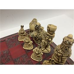 Alice in Wonderland themed chess set, with a complete set of composite figures, modelled as characters including Alice, Tweedledum and Tweedledee, the White Rabbit and the Mad Hatter, etc
