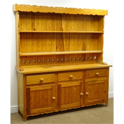  Pine kitchen dresser, with twin shelf back above three drawers and three cupboards, tapered supports, W172cm, H183cm, D45cm  