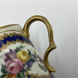 Sèvres soft paste porcelain coffee can and saucer with date code for 1767, painted with floral and laurel leaf garlands within blue scalloped and gilt borders, interlaced LL monogram enclosing the date letter O above painters mark for Catrice, coffee can H7.5cm, saucer D15cm