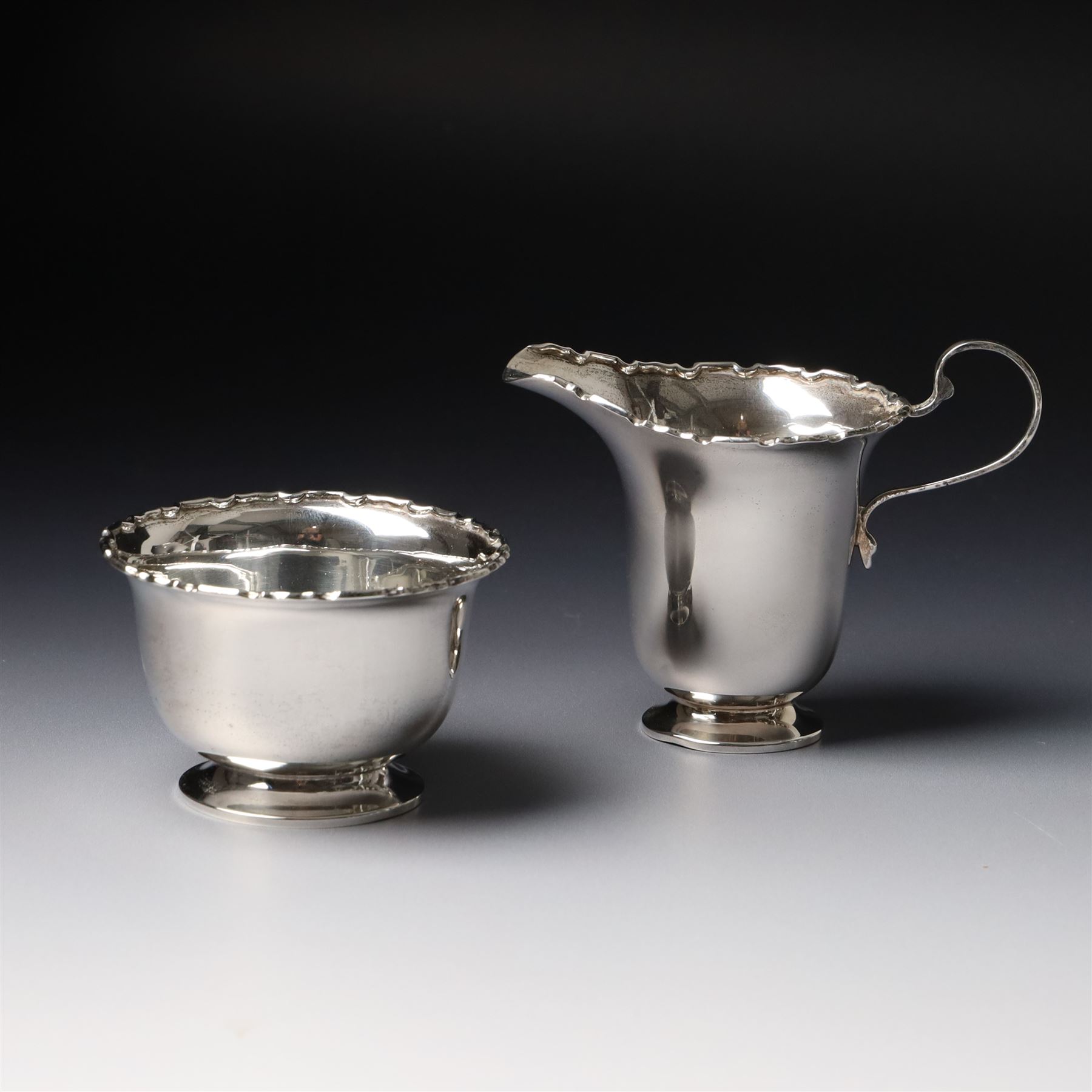 Silver sugar bowl and matching cream jug with crimped rims Birmingham 1938 Maker Adie Bros.