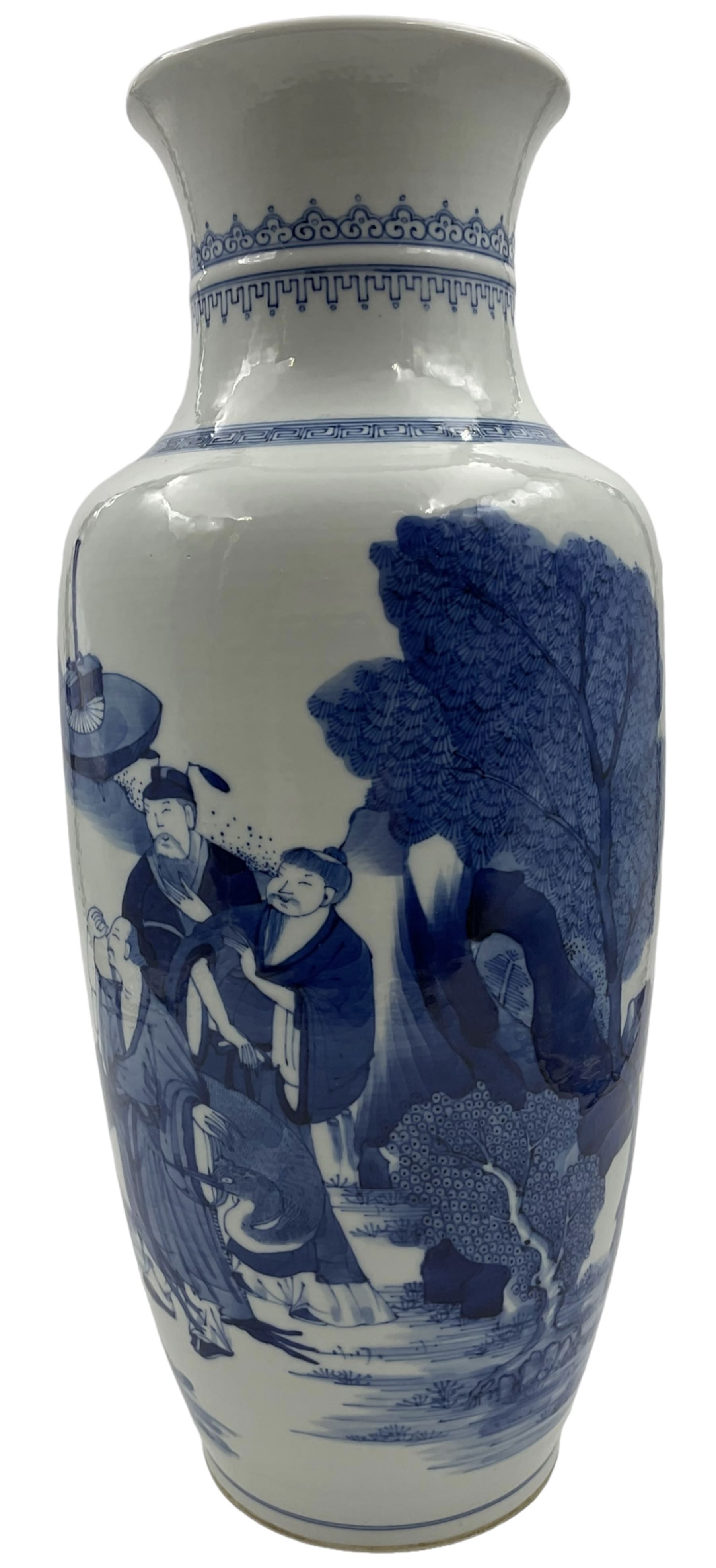 A Chinese blue and white Qing dynasty style vase, painted in underglaze blue with figures in a rocky landscape, six character Kangxi type mark to base, H34cm