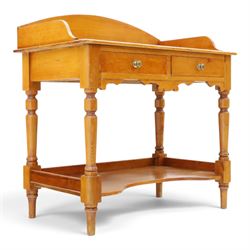 Victorian pine washstand, raised three quarter galleried top, fitted with two drawers, raised on turned supports united by a shaped full length under tier 