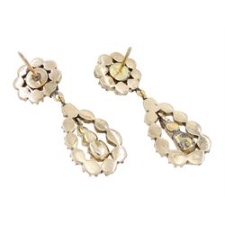 Pair of 19th century gold and silver rose cut diamond pendant earrings, each stud with a pear shaped diamond pendant and drops, suspending from a cluster of diamonds