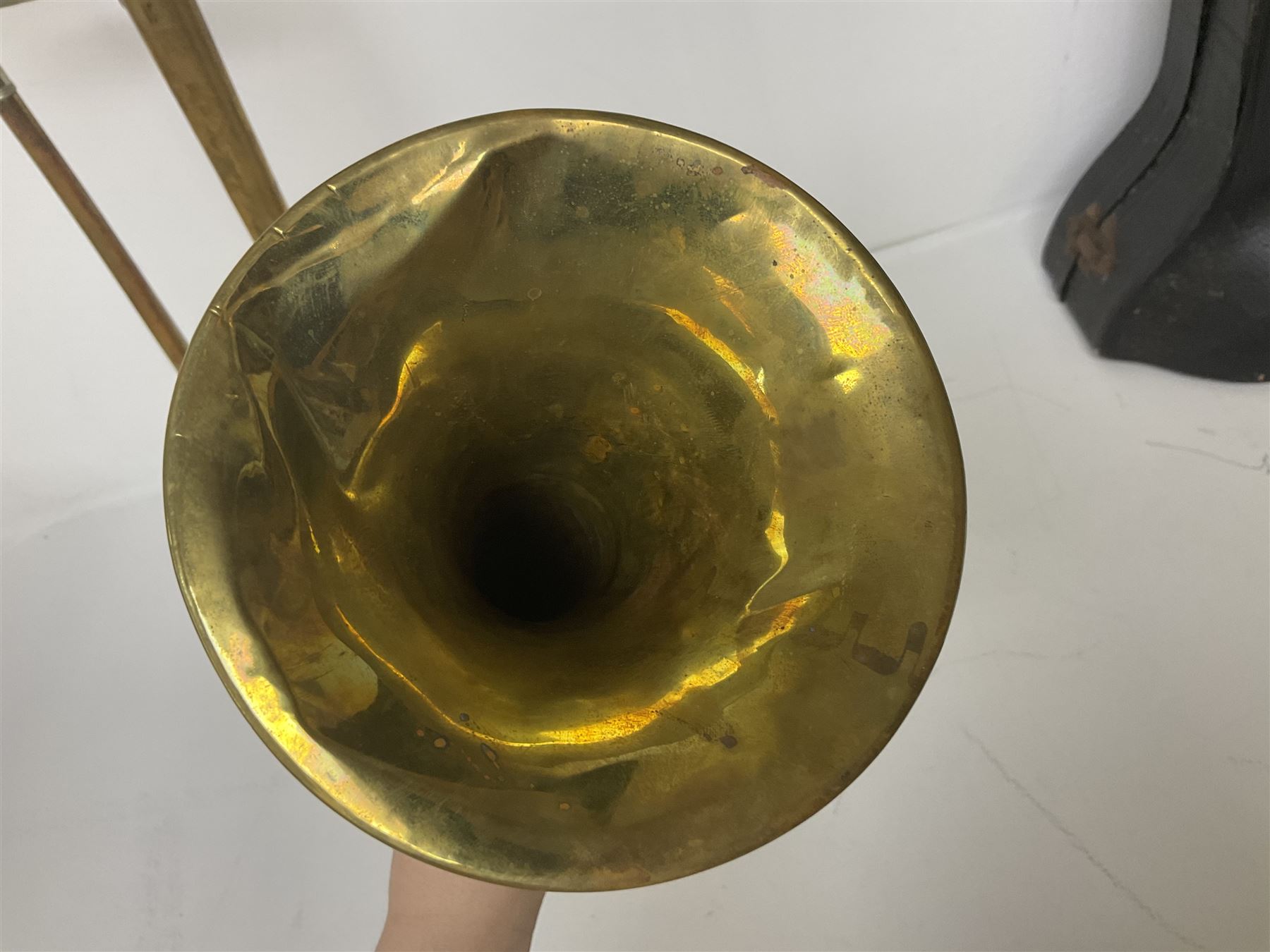 Three brass trombones comprising Elkhart Ind. USA 'CONN' model no.72H; Besson 'Concord'; and Selmer Distributed 'Lincoln'; two in carrying cases; and German B & M 'Champion' brass trumpet (4)