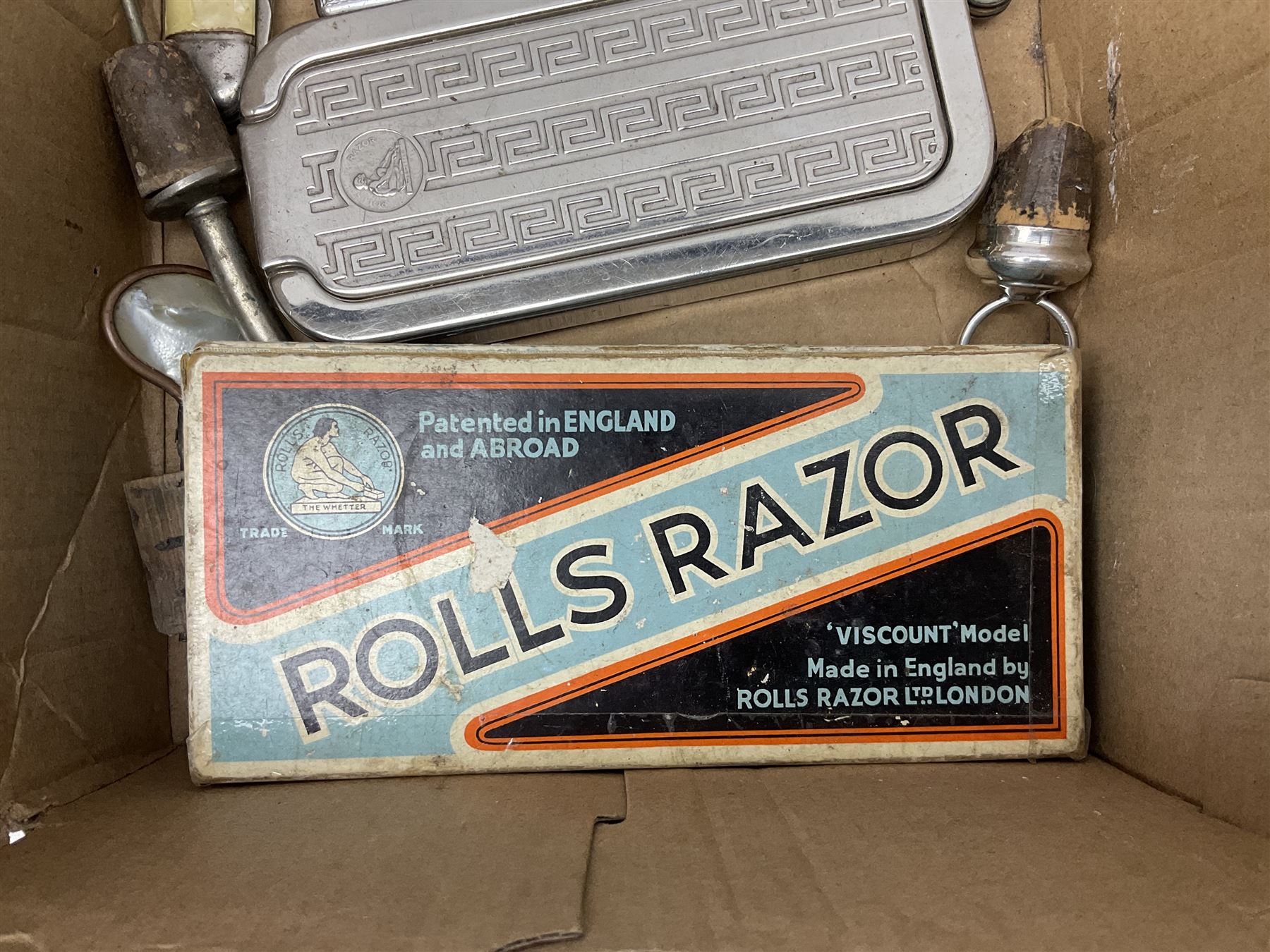 Collection of various razors and smoking items to include Ronson brass table lighter, Rolls Razor, Seigneur case with lighter, etc
