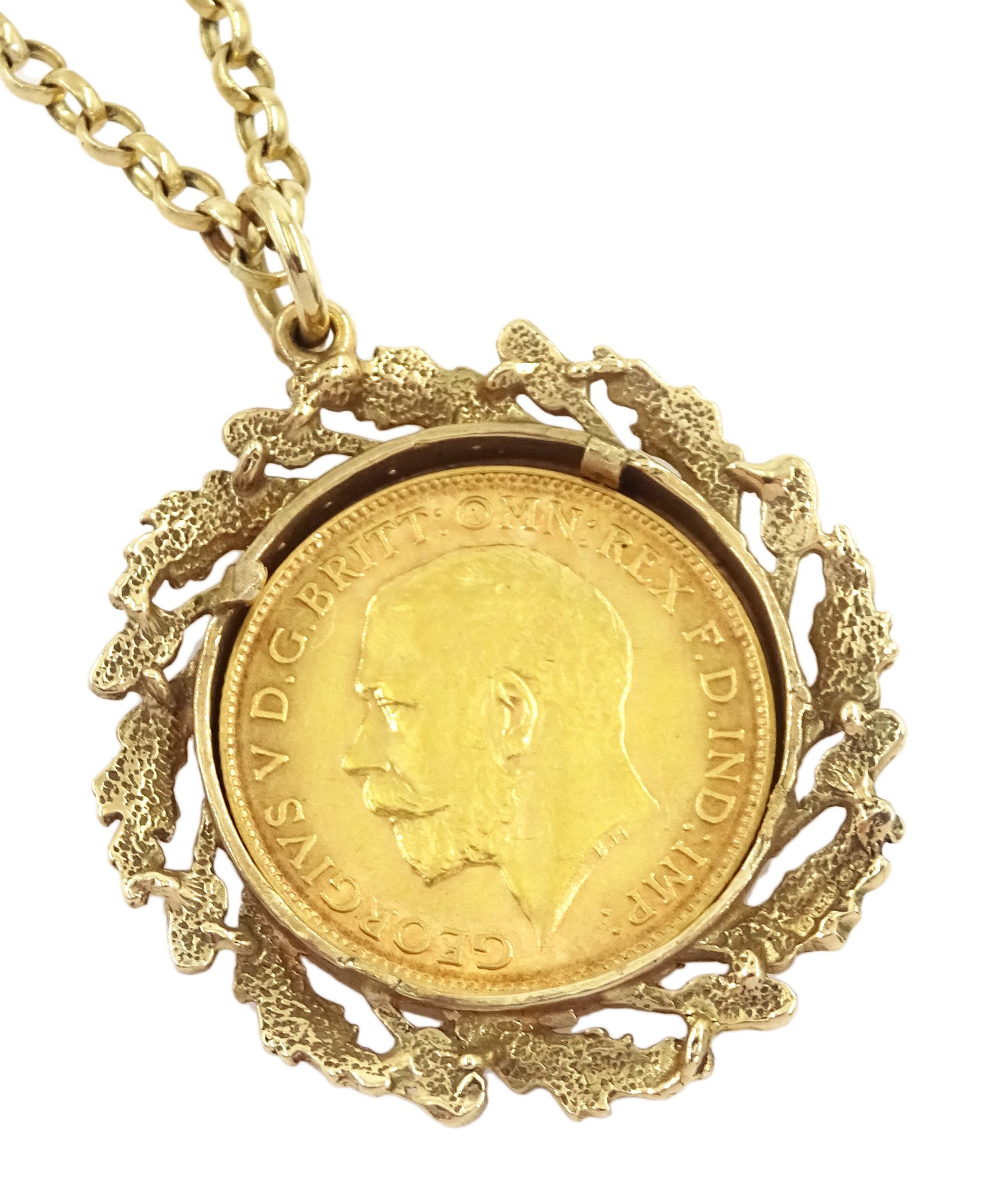 King George V 1911 gold half sovereign coin, loose mounted in acorn and oak leaf mount, on gold chain link necklace, both 9ct