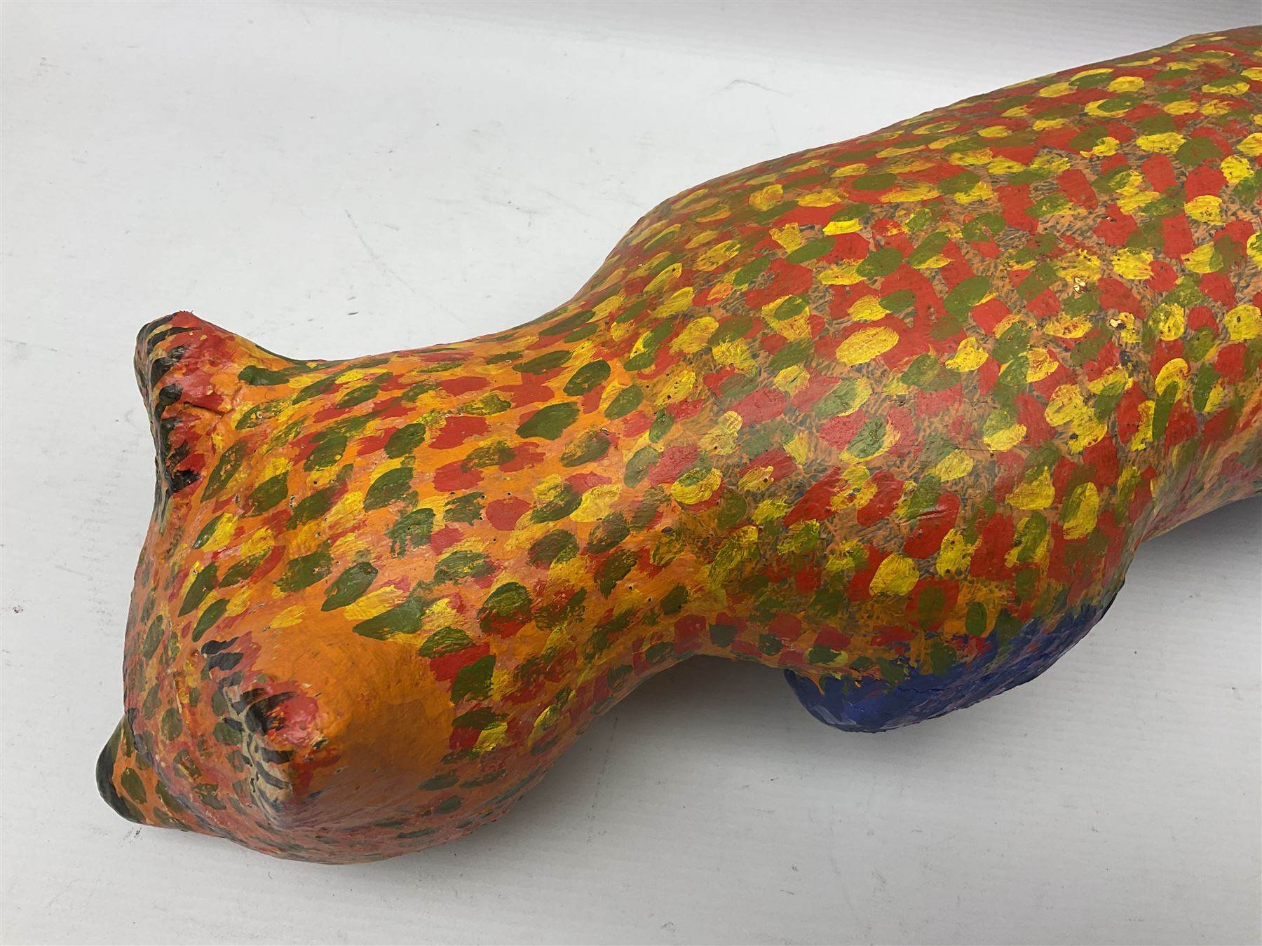 Helen Skelton (British 1933 – 2023): Two carved wooden abstract sculptures, one modelled as a dog, the other modelled as a bear, both with painted stippled decoration, largest H20cm. Born into an RAF family in 1933 in Kent and travelled the world extensively during her childhood. After settling in Bridlington, Helen immersed herself in painting, textiles, and wood sculpture, often inspired by nature's beauty. Her talent was showcased in a one-woman show at Sewerby Hall and recognised with the sculpture prize at Ferens Art Gallery in 2000. Sadly, Helen’s daughter passed away from cancer in 2005. This loss inspired Helen to donate her sculptures to Marie Curie upon her passing in 2023.