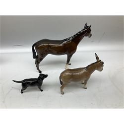 Three Beswick figures, comprising black labrador no 1956, donkey no 2267 and donkey foal no 2110, together with three Royal Doulton figures, one of a cat with a newspaper and two bay horses  