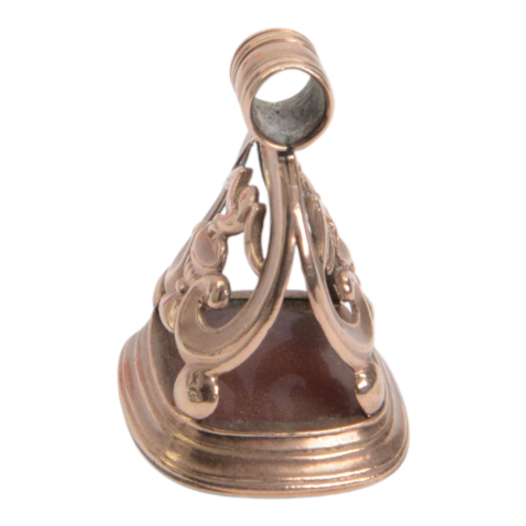 Late 18th/early 19th century 9ct gold fob seal, the carnelian matrix engraved with coat of arms, depicting a shield surmounted by a bird with foliage within its beak, within a scrolling mount detailed with a bird drinking from a chalice, H3.5cm 

Provenance: By family descent from the Chichesters of Arlington Court, Devon; from the collection of Andrew Chichester Everitt.