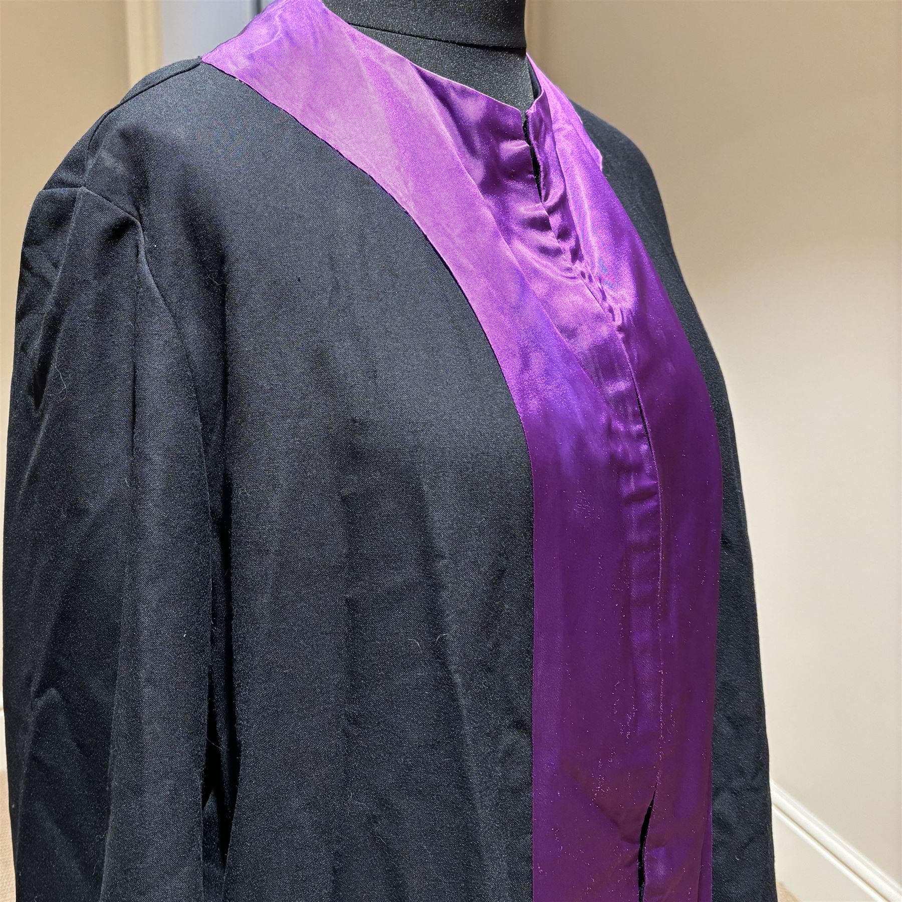 Ede & Ravenscroft two barrister/ judge horsehair wigs in fitted tins by 'Ede & Ravenscroft Law Wig & Robe Makers 93/4 Chancery Lane, London, inscribe upon the tins 'Ian R.Britton.Esq' and His Hon Judge Britton, together with judges robe 