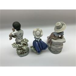 Pair of Lladro figures designed by Jose Roig, Bongo Beat no. 5157 and A Step in Time no. 5158 and a Lladro figure of a girl with a basket of flowers.
