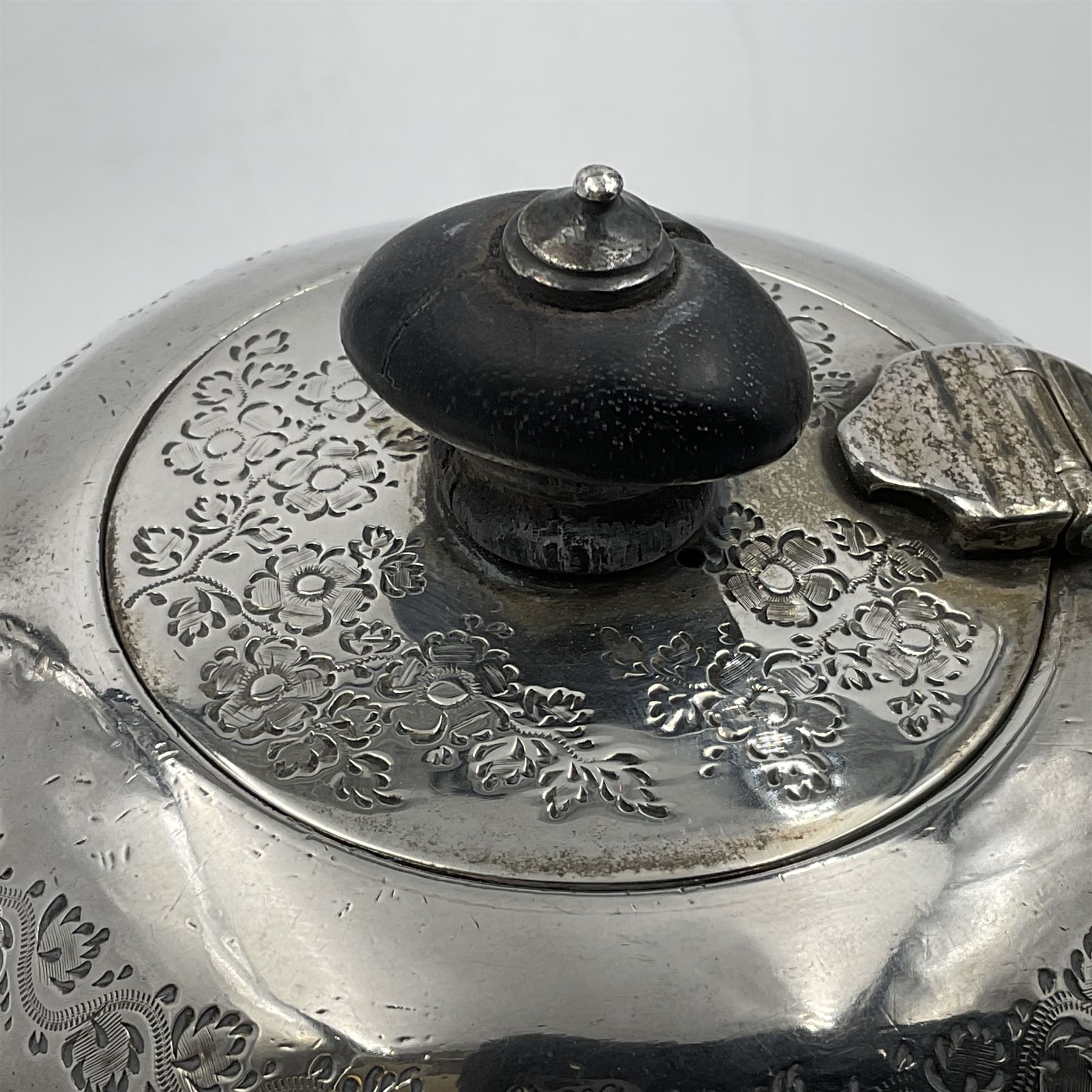 Late Victorian silver bachelors three piece tea service, comprising bullet shaped teapot, open sucrier and milk jug, each engraved with monogram surrounded by birds upon and amidst a blossoming vine, the teapot with scroll capped curved wooden handle and wooden finial to cover, hallmarked Wakely & Wheeler, London 1890, teapot including handle H12cm, sucrier H5.5cm 