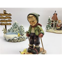 Eight Christmas Hummel figures by Goebel, to include Wintertime Chapel candle holder, Winter Fun, Christmas Morning, Christmas Time and Gingerbread Lane, tallest H21cm